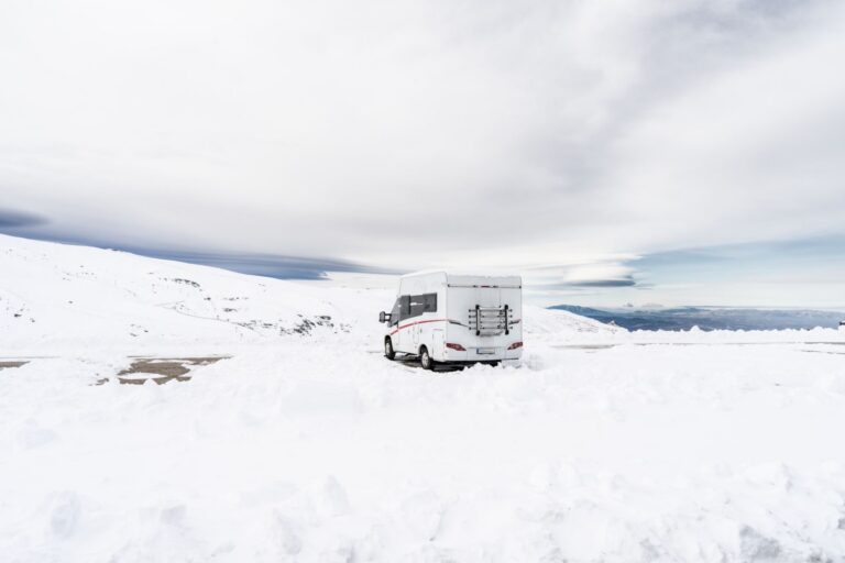 Motorhome parked in snowy California mountains in winter